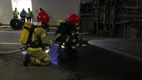 Firemen and emergency rescue workers performing disaster managing drill Stock Footage 236486738