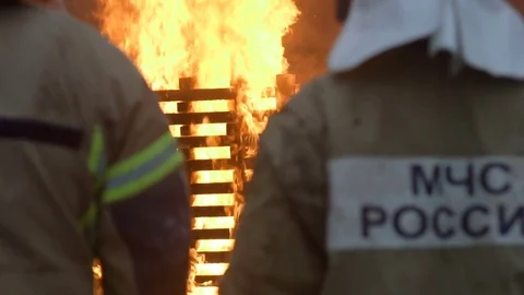 Firemen Are Looking At The Big Fire Stock Footage 74700821