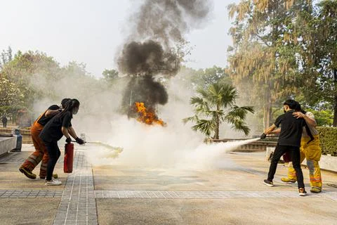 Firemen are training in the use of fire extinguishers. Stock Photos