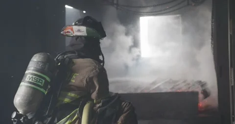 Firemen battle blaze Stock Footage 220574491