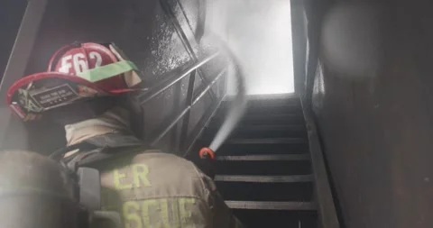 Firemen battle blaze Stock Footage 220575059