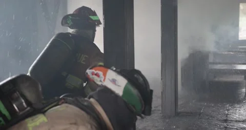 Firemen battle blaze Stock Footage 220576081
