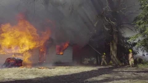 Firemen battle huge flames Stock Footage 60983748