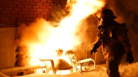 Firemen breaking window of the basement Stock Footage 105918826