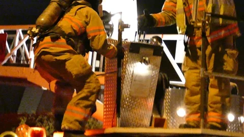 Firemen Brings tool up the Ladder to do Ventilation - 24fps 1080p Video stock 91561144