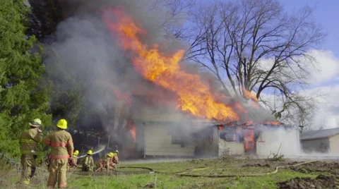 Firemen can't put out burning house Stock Footage 61170920