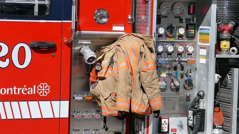 Firemen coat on a firetruck Stock Footage 99841447