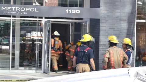 Firemen in condo building downtown Stock Footage 99841564