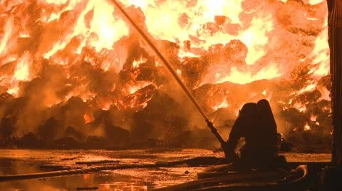 Firemen discuss how to attack a huge blaze Stock Footage