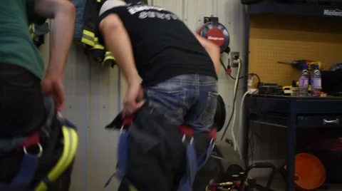 Firemen dressing quickly Video stock 50224781