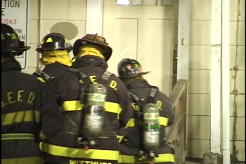 Firemen Enter Burning House Stock Footage 297511