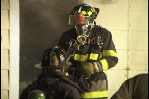 Firemen Exit Burning House Stock Footage 297512