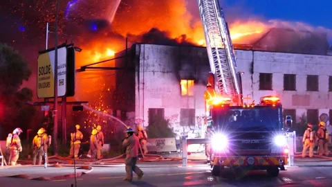 Firemen extinguishing flames Stock Footage 115968482