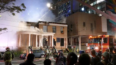 Firemen fighting to put out a fire at night - 2018 - 2019 Stock Footage 117068601