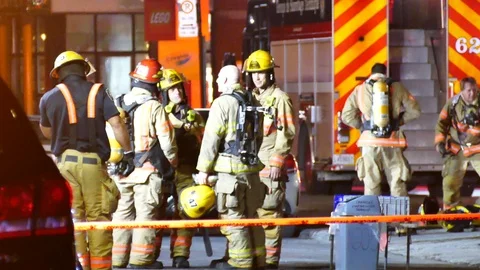Firemen at fire incident Stock Footage 116019359