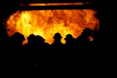 Firemen in the fire Stock Photos