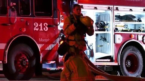 Firemen at fire with water hoses Stock Footage 116012142