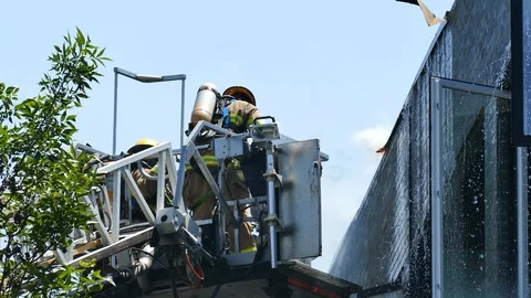 Firemen with flames and ladder Stock Footage 114810772