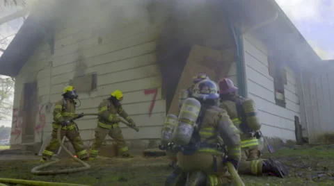 Firemen get ready to put out fire Stock Footage 60738818
