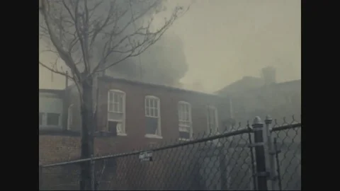 Firemen getting into the burning building to rescue - 1968 Vídeo Stock 83659246
