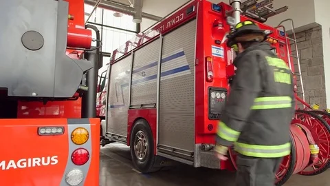 Firemen getting to truck Stock Footage 77099625