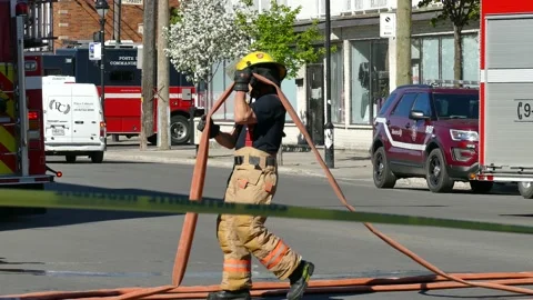 Firemen getting water out of the hose Stock Footage 139664486