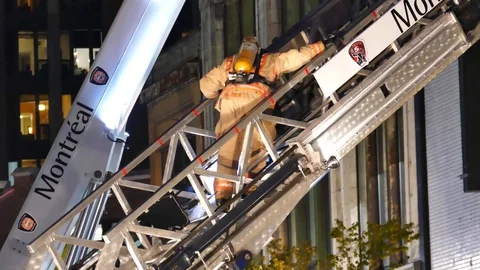 Firemen going down of ladder Stock Footage 99874631