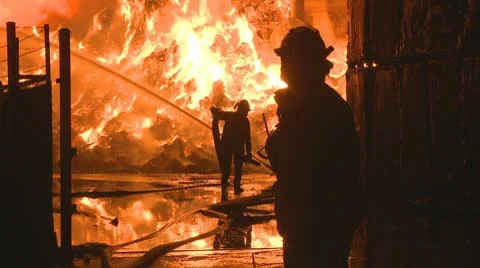 Firemen at an Industrial fire Stock Footage 10686056