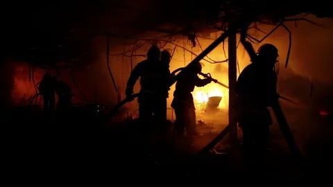 Firemen inside burning building Stock Footage 74397179