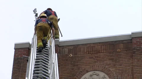 Firemen up ladder Video stock 1059728