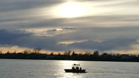 Firemen at on the lake at sunset Stock Footage 139658890