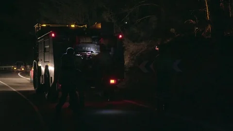 Firemen at night Stock Footage 74625342