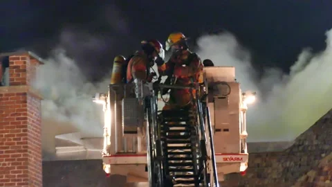 Firemen on platform working hard Stock Footage 139657160