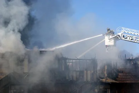 Firemen putting out a fire Stock Photos