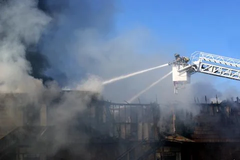 Firemen putting out a fire Stock Photos