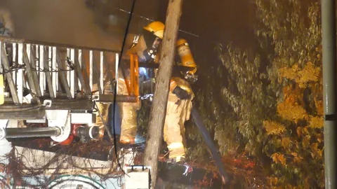 FIremen putting wood on the ground Stock Footage 120164919