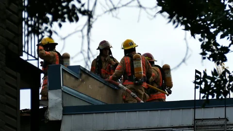 Firemen on the roof Stock Footage 116713213
