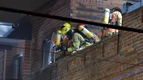 Firemen on the roof working Stock Footage 116710508