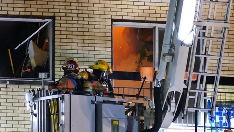 Firemen on-scene of an actual fire Stock Footage 114751243