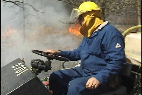 Firemen Spray Forest Fire 2 Stock Footage 297520