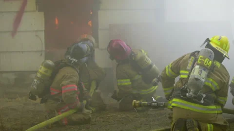 Firemen spray water on huge flames Stock Footage 60762004