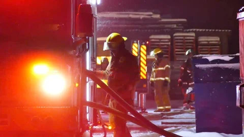 Firemen on structure fire scene Stock Footage 101993269