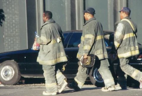 Firemen take a break from working at Ground Zero on 9/11 in NYC Stock Photos