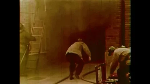 Firemen taking hose lines into a school, taking children out of the school and Stock Footage 146471899