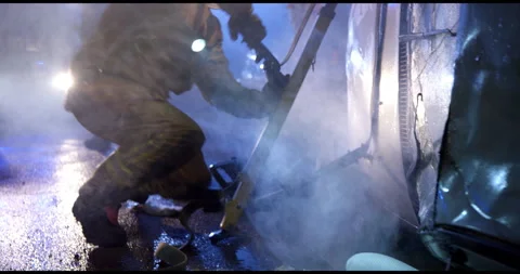 Firemen Trying To Get In Burning Car Stock Footage 143537927