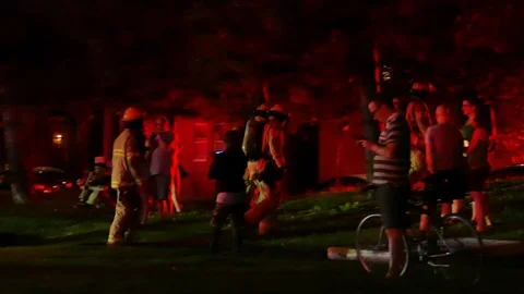 FIremen walking through crowd Stock Footage 116013707