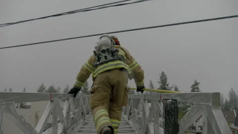 Firemen Walks Down Long Ladder Stock Footage 137552690