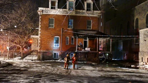 Firemen watching structure fire Stock Footage 125232487