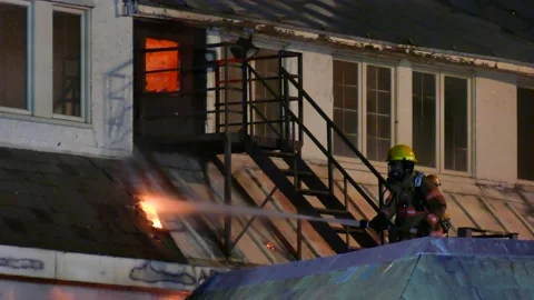 Firemen working on active flames Stock Footage 139657084