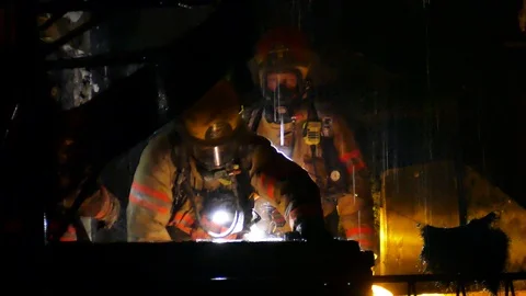 Firemen working in the dark Stock Footage 120162533